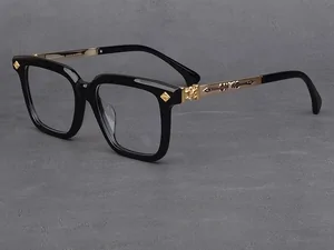 Black square spectacle frames on a grey surface
