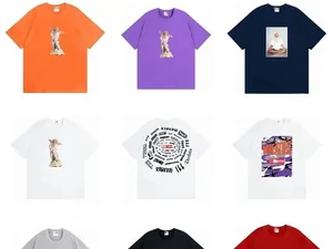 A grid of printed T-shirts in orange, purple, navy and white